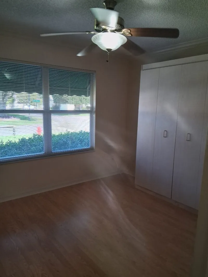 Empty room with closet and window after a move-out cleaning